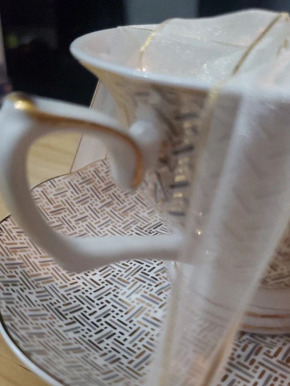 White and Gold Porcelain Teacup & Saucer - Decorative Pattern